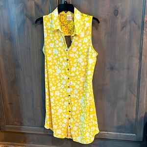 Yellow Sleeveless Dress with white flowers.